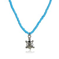 LIGHT BLUE SEED BEAD CHOKER W/ TURTLE