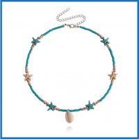 BLUE SEED BEAD PENDANT W/ STARFISH & COWRIE SHELL