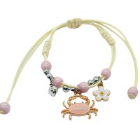 ADJUSTABLE BRACELET W/ BELL, CRAB & DAISY