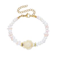 LIGHT PINK SHELL BRACELET W/ TURTLE