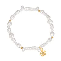 PEARL ELASTIC BRACELET WITH GOLD FLOWER